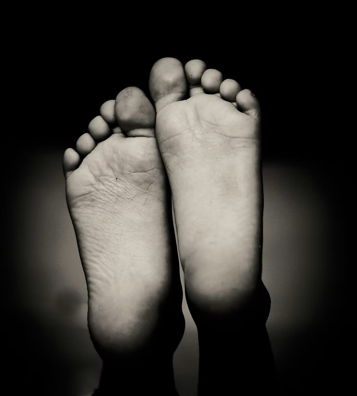 Close-up of bare feet in soft black and white